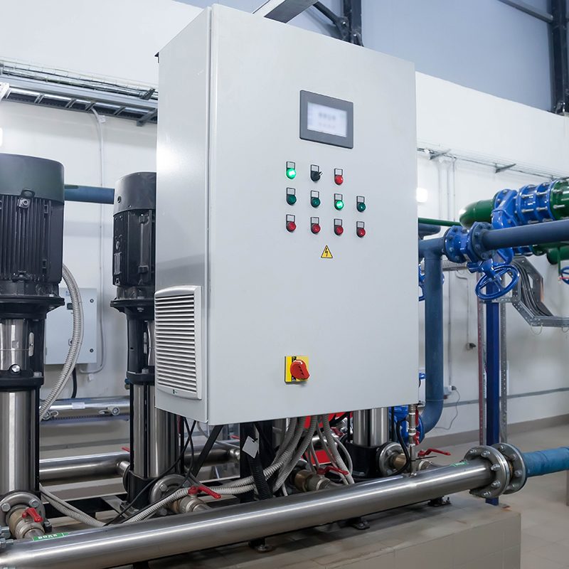 Water pump station and pipeline with tanks in an industrial room to supply high pressure water for firefight tasks. Sprinkler pipes and control system to provide drink water to people in building